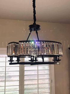 a chandelier hanging from the ceiling in a room