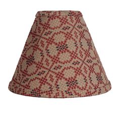 a red and beige lamp shade on a white background