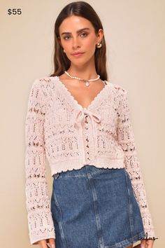 Brighten up everyone's day with a sweet aesthetic like the Lulus Casually Precious Pink Marled Crochet Tie-Front Cardigan Sweater! Medium-gauge, pierced crochet knit fabric (with a marled effect throughout) shapes this extra-cute cardigan with long sleeves, a V-neckline, and a relaxed bodice that secures with a tying bow detail. Cute scalloped edges at the neckline, cuffs, and hem complete the look. Bralette not included. Fit: This garment fits true to size. Bust: Great for any cup size. Waist: Sweet Aesthetic, Boho Whimsical, Crochet Tie, Casual Formal Dresses, Sweater Crochet, Lulu Fashion, Cute Cardigans, Tie Front Cardigan, Casual Wedding Dress