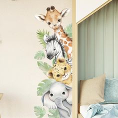 there is a giraffe, zebra and other animals on this wall decal