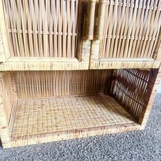 a wicker book shelf with two shelves