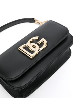 Meet your new go-to accessory. This stunning black leather bag is as versatile as it is chic, perfect for any occasion. It's the little details that make all the difference. Crafted from luxurious black calfskin leather Features a front flap with a double magnet closure Adorned with an elegant DG logo Includes a removable handle and a sliding chain shoulder strap Equipped with an internal flat pocket for easy organization Accented with gold metal hardware | Dolce & Gabbana Women's 3.5 Leather Sh Texture Logo, Debossed Logo, Chic Bags, Leather Cap, Genuine Leather Handbag, Black Leather Handbags, Beach Tote Bags, Black Cross Body Bag, Dolce & Gabbana