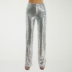 Shine bright and stand out in style with Premier Amour sequin women's flare trousers. Made from high-quality fabric, these trousers feature a flat front and a convenient zipper closure. The straight fit and waist rise ensures comfort. Pair with a sequin crew neck blouse for a chic look.Front Style: Flat FrontFeatures: SequinsClosure Type: ZipperFit: Straight FitRise: At WaistFiber Content: 95% Polyester, 5% SpandexFabric Description: MeshLining: Fully LinedLining Material: PolyesterInseam: 31 In Sparkle Pants Outfit, Sparkle Pants, Flare Trousers, Pants Trousers, Shine Bright, Fit & Flare, Trousers Women, Quality Fabric, Trousers