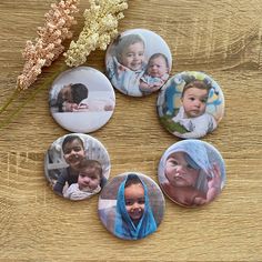 four buttons with pictures of people on them and flowers in the middle one has a baby's head