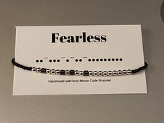 This bracelet has a message in morse code, so only the person wearing it will know what it says.  It comes in a gift box with a message card revealing the secret message. The dots are 3mm round silver hematite beads, the dashes are 3mm cylinder black hematite beads.  Each word is separated by a 2mm white alabaster bead.  The remainder of the bracelet is banded with 3mm black onyx beads.  All strung on sturdy .8mm elastic string. Available in several sizes.  Measure your wrist by wrapping a fabric tape measure around.  The number of inches is the size you want to order Find more selections in my shop: essentialjewels2022.etsy.com visit me on facebook: https://www.facebook.com/essentialjewels2022 email me: renee@essentailjewels.store visit my website: http://essentialjewels.store Nickel-free Modern Beaded Bracelets As Gift, Modern Nickel-free Beaded Bracelets For Gifts, Minimalist Hypoallergenic Silver Friendship Bracelets, Mores Code Bracelets, Bracelet Sayings, Appalachian People, Code Bracelets, Code Morse, White Alabaster