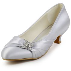 a women's silver wedding shoe with a bow on the heel