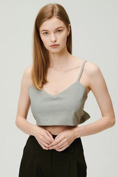 Sleeveless top Adjustable tie Crop length Unlined 60% Polyester 36% Rayon 4% Span Professional Clean Only / Do Not Tumble Dry Top: Bust: 47.5cm (18.7in) / Length: 23cm (9.1in) /Tie: Length: 85cm (33.5in) / Model's height is 7′ 5″ (170cm) Bust 32.5in Waist 23.5in Hip 34in and wearing Top Made in Korea 사이즈 정보Size information (단위:cm)(Unit : inch) FREETop 사이즈 정보 Size information 가슴Bust 47.518.7 총장Length 239.1 XTie 사이즈 정보 Size information 총장Length 8533.5 - 위의 실측사이즈는 '단면의 길이'입니다. 참고해 주세요.- 사이즈는 측정방법에 따라 1~3cm 정도 오차가 있을 수 있습니다.- 제품색상은 사용자의 모니터의 해상도에 따라 실제 색상과 다소 차이가 있을 수 있습니다. - The above measurement size is'length of section'. please note.- Depending on the measurement method, there may be an error of 0.5~1inch.- The product color may differ slightly from the actual color depending on the resolu Elegant Summer Vest Crop Top, Fitted Gray Sleeveless Camisole, Gray Sleeveless Crop Top For Summer, Fitted Summer Vest With Straps, Chic Spring Tank Vest, Chic Cami Vest For Spring, Fitted Gray Summer Camisole, Chic Camisole Vest For Spring, Chic Spring Camisole Vest