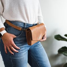 This favorite "little" bag that can be worn as a belt bag, crossbody, and a mini shoulder bag. Designed to hold your most important essentials including your cards, phone (fits all sizes), car keys, coins, and sunglasses, this bag features an accordion style interior, keeping even the basics organized. Features: 8.25" wide, 5.25" tall, 1.5" deep strap length at its shortest is 23.5" and at its longest is 45" Fits as a belt bag for waist size 2 and up Has 8 cards slots in the interior Fits all ph Chic Everyday Crossbody Belt Bag, Versatile Everyday Rectangular Belt Bag, Chic Everyday Belt Bag With Adjustable Strap, Classic Everyday Phone Bag With Removable Pouch, Classic Phone Bag With Removable Pouch For Everyday, Modern Everyday Shoulder Belt Bag, Classic Crossbody Belt Bag For Everyday, Classic Everyday Belt Bag For Mobile Phone, Versatile Belt Bag For Everyday Use