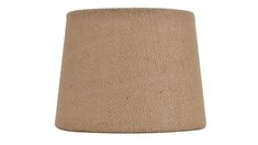 a beige lamp shade is shown against a white background and it looks like the fabric has been