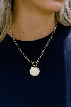 This 18k gold plated necklace features a vintage coin pendant, adding a touch of classic elegance to any outfit. Measuring 16 inches in length, it is handmade in Brazil, showcasing exceptional craftsmanship and timeless style. Perfect for layering or wearing on its own. Pairs with Liona ,Kindra and Sonya Earrings. Gold-tone Medallion Necklace With Coin Pendant, Yellow Gold Medallion Necklace With Adjustable Chain, Yellow Gold Medallion Coin Necklace With Adjustable Chain, Round Brass Coin Necklace, Tarnish Resistant, Round Brass Coin Necklace Tarnish Resistant, Tarnish Resistant Round Brass Coin Necklace, Classic Brass Jewelry With Coin Pendant, Brass Coin Charm Necklace Tarnish Resistant, Durable Brass Coin Necklace With Round Pendant