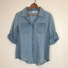 Kim Rogers Light Denim Button Down Size Medium Nwt Quarter Sleeve Medium Wash Button-up Denim Top With Buttoned Pockets, Washed Blue Chambray Denim Top With Buttons, Light Indigo Denim Button-up Top, Blue Button-up Denim Top With Button Cuffs, Light Wash Denim Top With Buttoned Pockets, Blue Denim Button-up Top With Button Cuffs, Summer Button-up Denim Top With Snap Buttons, Spring Chambray Denim Top With Button Closure, Collared Denim Top With Button Closure