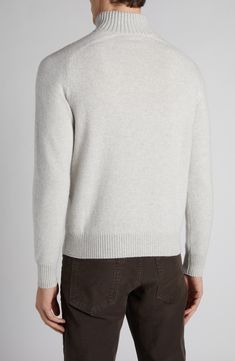 This cozy pullover sweater is knit with a chunky rib collar and streamlined raglan sleeves from an ultrasoft blend of lambswool and cashmere. Subtle leather details accent the zipper and puller. 26 1/2" length (size 50EU) Half-zip closure Stand collar Long sleeves Ribbed cuffs and hem 67% wool, 33% cashmere with leather trim Dry clean Made in Italy Designer Clothing Winter Cashmere Sweater With Ribbed Neckline, Winter Cashmere V-neck Sweater With Ribbed Cuffs, Winter Lambswool Sweater With Ribbed Cuffs, Winter Wool Sweater With Ribbed Neckline, Winter Merino Wool V-neck Sweater With Ribbed Cuffs, Cozy Cashmere Sweater With Ribbed Collar, Winter Cashmere Polo Sweater With Ribbed Collar, Cozy Wool Polo Sweater With Ribbed Collar, Cozy Wool Polo Sweater With Ribbed Cuffs