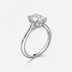 a diamond engagement ring on a white background