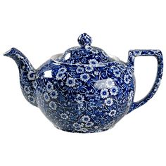 a blue and white teapot with flowers on the top, sitting in front of a white background