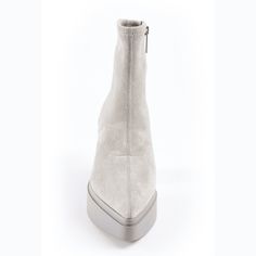 The timeless soul of '70s rock translates to this wear-anywhere ankle sock boot handcrafted in a pointy toe, strech suede and minimalist design. Details & Fit Fit is True to size Color: Gray stretch suede Detail: Pointy toe, SIde zippr for easy on, easy off. Heel measures approximately 3.5 inches//1 1/4 inch platform Shaft 6.5 inches Leather Upper and lining, Manmade sole Available in half sizes, available in sizes 5.5-11 imported Modern High Ankle Suede Heeled Boots, Suede Pointed Toe Platform Boots, Suede Platform Boots With Pointed Toe, Modern Suede High Ankle Boots, Fitted Suede Platform Boots, Modern Fitted Ankle Platform Boots, Sock Boot, Hair Care Gifts, Flat Heel Boots