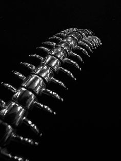 a black and white photo of an object that looks like it is made out of metal