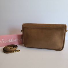 "Vtg Coach Original Convertible Clutch Taupe Putty soft and supple leather with brass hardware Roomy interior with one inner zippered pocket, outer slip pocket covered by a flap and secured with a turnlock Detachable 40\" strap with anchor stamp Hang tag and chain Measures: 11 5\"L, 7.5\"H, 2\"W Made in the New York, USA #459-4542 Amazing condition Cleaned, conditioned and ready to wear! Questions? Just ask More vintage coach styles/colors are also available G63" Beige Shoulder Bag With Brass Hardware For Travel, Everyday Double Flap Bag With Removable Pouch, Double Flap Bag With Removable Pouch For Everyday Use, Everyday Use Bags With Removable Pouch And Double Flap, Beige Travel Bag With Brass Hardware, Travel Satchel With Removable Pouch And Double Flap, Beige Double Flap Shoulder Bag For Travel, Classic Beige Bags With Brass Hardware, Travel Crossbody Flap Bag With Brass Hardware