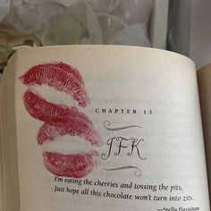 an open book with lipstick imprints on it