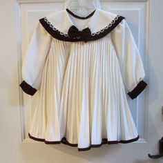 Pleated Dress Gorgeous With Maroon Velvet Piping For Flair Fitted Doll Collar Dress For School, Cute Winter Dress For School, White Winter Dress For Dress-up Occasions, Cute Cream Winter Dress, White Long Sleeve School Dress, White Cotton Winter Dress, White Pleated Dress, Pastel Floral Dress, Light Up Dresses