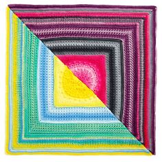 a multicolored crocheted square is shown in the shape of a triangle