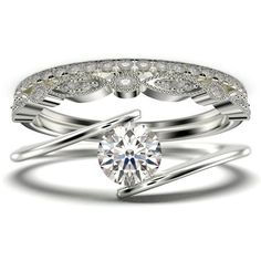 an engagement ring with a diamond in the center and two wedding bands on each side