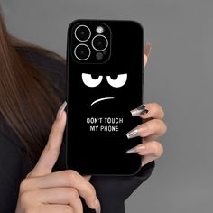 a woman holding up her phone case with the text don't touch my phone