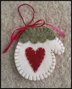 a felt ornament with a heart on it