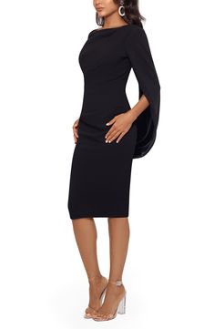 In this chic cocktail dress, your cape-sleeved arms encourage you to embellish every story with a dramatic flourish. 94% polyester, 6% spandex Dry clean Made in the USA Fitted Pre-draped Evening Dress With Cape Sleeves, Fitted Evening Dress With Draped Sleeves And Asymmetrical Neckline, Elegant Evening Dress With Asymmetrical Neckline And Draped Sleeves, Elegant Evening Dress With Draped Sleeves And Asymmetrical Neckline, Elegant Black Evening Dress With Draped Sleeves, Cocktail Evening Dress With Draped Sleeves And Asymmetrical Shape, Cocktail Evening Dress With Cape Sleeves, Sleek Party Dress With Draped Sleeves, Fitted Evening Dress With Cape Sleeves