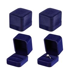 three blue velvet jewelry boxes with one ring in the middle and two on each side