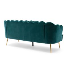 a green couch with gold legs and scalloped backrests on an isolated white background