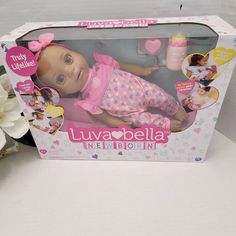 the doll is in its box on the table