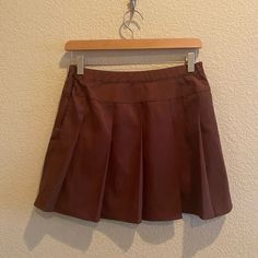 New With Tags. Wild Fable Womens Size Extra Small Skater Tenis Box Pleats Skirt Color Brown. Materials Include Polyester, Rayon, And Spandex. Semi A-Line Style Mini Skirt With Zipper Closure. Makes For A Cute Outfit For Any Season. Approximate Measurements: Waist: 14.5 Inches Length: 15 Inches Thank You! Brown Pleated Short Skort, Spring Pleated Brown Tennis Skirt, Spring Brown Pleated Tennis Skirt, High Waist Pleated Brown Skort, High Waist Brown Pleated Skort, High-waisted Pleated Brown Skort, Brown Lined Mini Skort, Fitted Brown Tennis Skirt, Fitted Brown Pleated Tennis Skirt