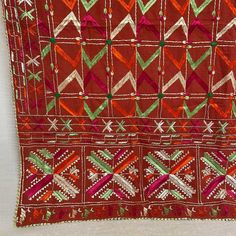 Antique Khadar Bagh is traditional hand embroidered phulkari made for special Punjabi Sikh wedding ceremonies. Mostly used for wedding jaago night, wedding day as a canopy and then gifted to the bride. Khadar Bagh phulkari is a symbol of happiness, prosperity and well being of a woman. Khadar Bagh - Made on hand dyed cotton cloth called khaddar with embroidery of silk threads. Fabric is hand spun and a handloom. Whole surface of the fabric in this bagh has been embroidered in geometric patterns. Red Bohemian Traditional Wear For Ceremonies, Traditional Embroidered Fabric With Handwork For Festive Season, Red Traditional Wear With Dupatta For Festival, Red Bohemian Dupatta For Traditional Ceremonies, Traditional Multicolor Handwork Dupatta, Traditional Red Dupatta With Handwork, Traditional Handwork Dupatta For Festive Occasions, Red Dupatta With Traditional Patterns For Navratri, Handwork Embroidered Fabric For Festivals