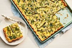 a quiche with asparagus and cheese is on a plate next to the casserole