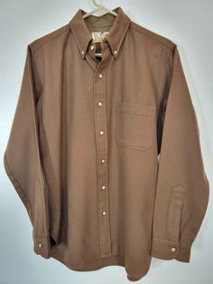 Winter is here! Here's a nice vintage 1970s Lobo by Pendleton Latte Brown Wool Button Down Long Sleeve Shirt Men's M Chest 44" Creamy brown wool with button-down collar. Lovely vintage condition with no rips, stains or holes. Fabric smooth and flat! Neck tag clipped - probably a store cutout. One little bump in fabric that might be a repair or flaw. It's a superb shirt! Please see our other listings for more vintage Pendleton garments with new items added nearly daily. PLEASE check the measureme Classic Brown Tops With Button Closure, Winter Brown Shirt With Buttons, Classic Brown Tops With Button Cuffs, Brown Button-up Shirt With Button Cuffs, Brown Long Sleeve Shirt With Snap Buttons, Brown Spread Collar Shirt For Winter, Retro Solid Shirt With Button Closure, Retro Solid Color Shirt With Button Closure, Vintage Brown Shirt For Workwear