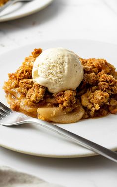 a white plate topped with waffles and ice cream on top of a table