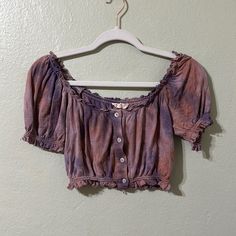 Very Unique Style. It Is Something Like A Blues, With Buttons Coming Down, A Fringed Collar, Sleeves, And Waist. Off-Shoulder As Well. Tie Dye Colors Of Purple And Pink With Shiny White-Like Buttons. Never Worn, Even Has The Button Tag Attached. Fair Offers Accepted Trendy Purple Cotton Blouse, Casual Purple Summer Blouse, Casual Purple Blouse For Summer, Summer Purple Cotton Blouse, Purple Cotton Summer Blouse, Purple Short Sleeve Summer Tops, Casual Mauve Summer Blouse, Casual Mauve Blouse For Summer, Purple Cotton Summer Top