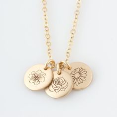 This birth flower necklace makes a beautiful gift! Choose from your choice from 1 - 5 discs personalized with the birth flowers of your kids & loved ones! Engraved and hand assembled with care and love, it comes in 14k gold fill, rose gold fill, or sterling silver. Morse Code Necklace, Birth Flower Necklace, Necklace Mom, Necklace Rose, Trendy Necklaces, Mom Necklace, Disc Necklace, Birth Flower, Birth Month