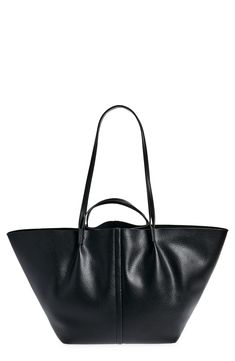 Made of smooth durable leather, this large tote bag features handle straps and shoulder straps for versatility of wear with a soft cotton lining and zip pouch. 23.5"W x 11.5"H x 6.75"D; 3" handle drop; 12" shoulder strap drop Cotton lining Leather Imported Allsaints Black Shoulder Bag For Everyday, Allsaints Leather Crossbody Bag, Modern Allsaints Crossbody Shoulder Bag, Leather Satchel With Handles, Allsaints Crossbody Bag For Everyday, Allsaints Modern Leather Bags, Allsaints Shoulder Bag With Removable Pouch For Everyday, Allsaints Black Travel Bag, Allsaints Leather Everyday Bag