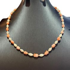 18" Carved tulip shaped pink coral and mother of pearl beaded necklace, with 14K gold filled clasp and beads. Marked 14K GF on the clasp. In very good vintage condition.  A unique Valentine's Day, Holiday, Christmas, Mother's Day gift for that special someone. Please contact me for combined shipping. Elegant Single Strand Coral Beads, Elegant Coral Necklaces With Gemstone Beads, Elegant Orange Pearl Necklace Gift, Elegant Orange Crystal Necklaces With Gemstone Beads, Elegant Coral Beaded Necklaces With Faceted Beads, Coral Faceted Beads Jewelry As Gift, Coral Faceted Beads Jewelry For Gifts, Elegant Coral Beaded Necklace With Faceted Beads, Elegant Gemstone Beads Shell Necklace As Gift