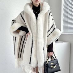 Winter Cape With Tassels, Elegant Winter Outerwear With Tassels, Winter Fringe Cape Outerwear, Chic White Winter Cape, Winter Shawl With Tassels, Winter Fringe Shawl Outerwear, Winter Shawl Cape With Fringe, Elegant White Poncho For Winter, Elegant White Winter Poncho