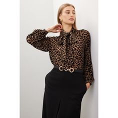 Multicolor leopard georgette (66% Viscose, 34% Silk). Top. Long sleeves. Tie neck. Tie closure. 26" from shoulder to hemline. Imported. Chic Leopard Print Blouse For Fall, Chic Leopard Print Tops For Work, Elegant Leopard Print Blouse For Fall, Fitted Leopard Print Blouse For Work, Chic Leopard Print Blouse For Party, Elegant Leopard Print Party Blouse, Leopard Print Long Sleeve Top For Work, Leopard Shirt, Tie Neck Tops