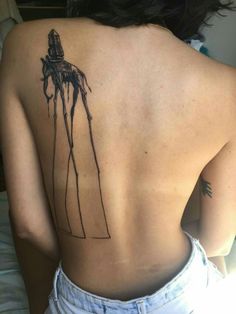 the back of a woman's upper body with a drawing of a man on it