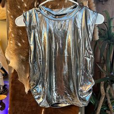 Trendy Metallic Silver High Neck Cropped Top. Brand New With Tags Never Worn!!!!! This Top Pairs Perfect With Metallic Silver Cargo Pants (Check Out My Other Listing). Perfect For Concert!!! Shiny Summer Tops For Night Out, Shiny Stretch Summer Tops, Shiny Stretch Tops For Summer, Metallic Shiny Summer Tops, Metallic Shiny Tops For Summer, Shiny Sleeveless Tops For Summer, Sleeveless Shine Tops For Night Out, Sleeveless Shiny Tops For Summer, Metallic Sheen Tops For Summer