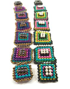 "\"Contemplation is the highest form of activity.\" - Aristotle Right Angle Weave Squares of multiple colors embellished with Swarovski pearls. Have fun using multi-colors of metal seed beads for each square. Make each one exactly the same or do what I did and make each one slightly different for added interest. You will need: Size 11/0 metal seed beads in five colors Swarovski 3mm pearls Size 4 Snap 14lb. Fireline is recommended for this project. INTERMEDIATE PROJECT - Must know Right Angle Wea Multicolor Square Beaded Jewelry, Multicolor Rectangular Beaded Bracelets For Festivals, Multicolor Beaded Rectangular Jewelry, Festival Multicolor Rectangular Beaded Bracelet, Multicolor Rectangular Bracelets With Colorful Beads, Handmade Adjustable Square Beaded Bracelets, Right Angle Weave, Right Angle, Bracelet Tutorial