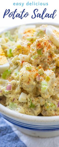 potato salad in a white bowl on a blue and white checkered table cloth with text overlay