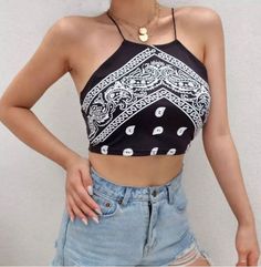 Elevate your style with our cute black print bandana-style cropped top! This versatile piece is perfect for both casual wear and a night out on the town. Summer Crop Top Halter For Night Out, Black Stretch Printed Tops, Trendy Summer Halter Top, Trendy Stretch Crop Top For Streetwear, Edgy Summer Halter Top For Night Out, Trendy Stretch Tops For Festival, Edgy Halter Top For Summer Night Out, Edgy Crop Top For Summer, Edgy Cropped Crop Top For Spring