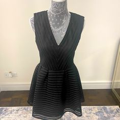 Fun And Flirty Black Semi-Deep V-Neck Textured Dress Light Weight Lined V-neck Mini Dress For Party, Party V-neck Lined Mini Dress, Cocktail V-neck Lined Mini Dress, Dressy V-neck Lined Mini Dress, Chic V-neck Mini Dress Lined, Chic Lined V-neck Mini Dress, Lined V-neck Mini Dress, Black V-neck Mini Dress, Black V-neck Mini Dress For Spring