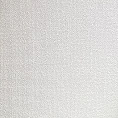 a white textured wall with small squares on it