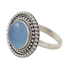 A round blue chalcedony stone is set atop this elegant cocktail ring. Presented by Neeru Goel the ring features traditional Indian rawa work that is handcrafted from sterling silver and enhanced by oxidized accents for a truly eye-catching accessory. Blue Moonstone Rings With Natural Stones, Adjustable Blue Moonstone Ring With Cabochon, Adjustable Blue Moonstone Cabochon Ring, Adjustable Blue Cabochon Moonstone Ring, Blue Round Bohemian Crystal Ring, Bohemian Round Cabochon Moonstone Ring, Bohemian Cabochon Moonstone Ring, Bohemian Blue Round Crystal Ring, Blue Opal Ring With Natural Stones